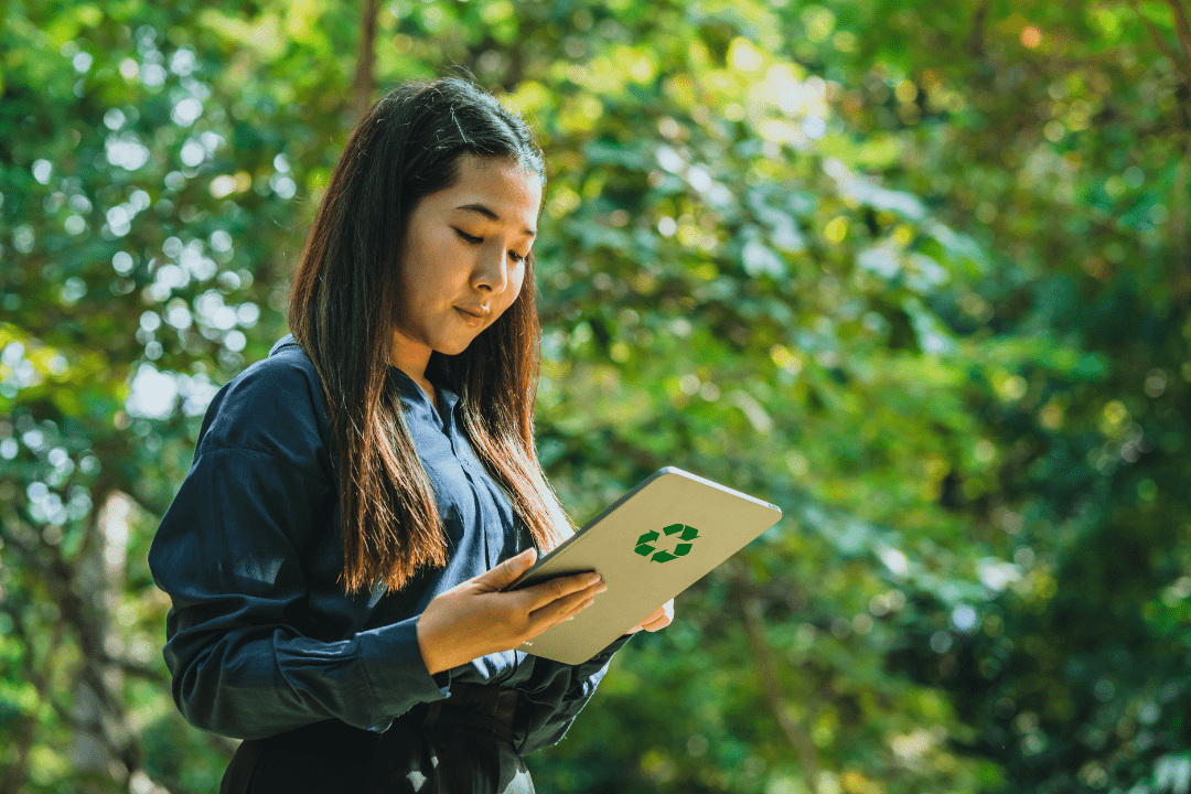 Woman work on tablet computer at park
