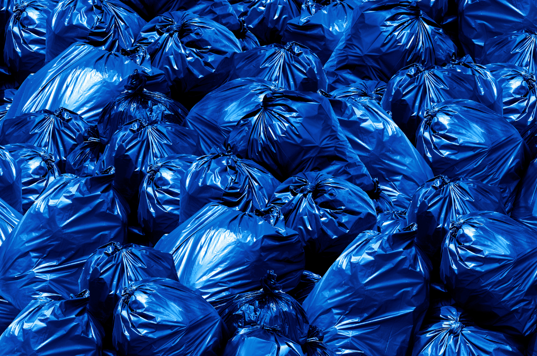 pile of trash bags, blue Bin