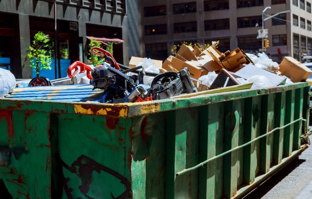 over flowing dumpsters being full with garbage