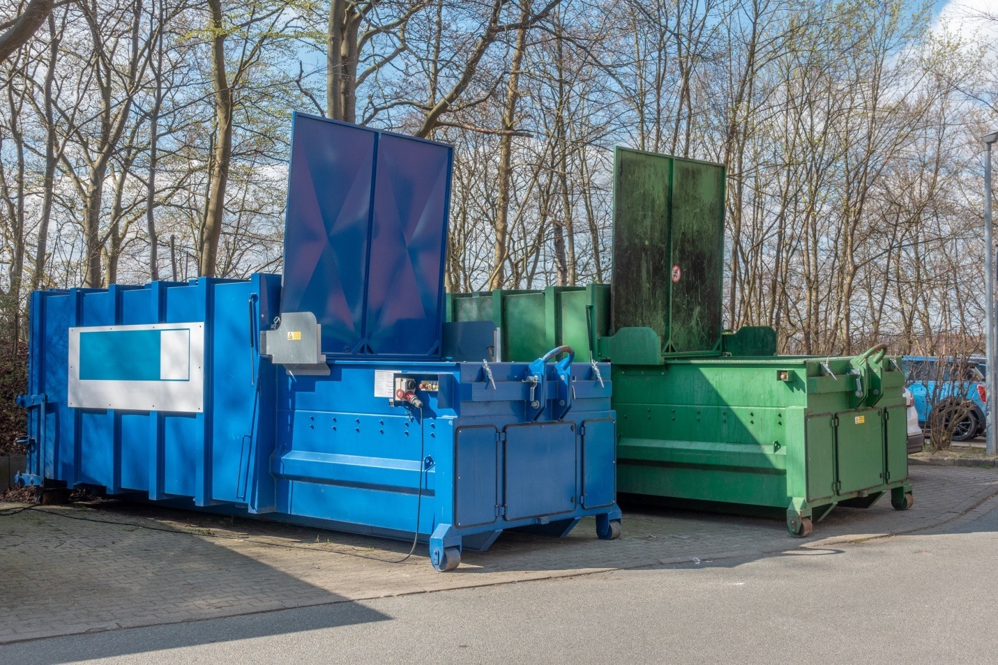 two large garbage compactors