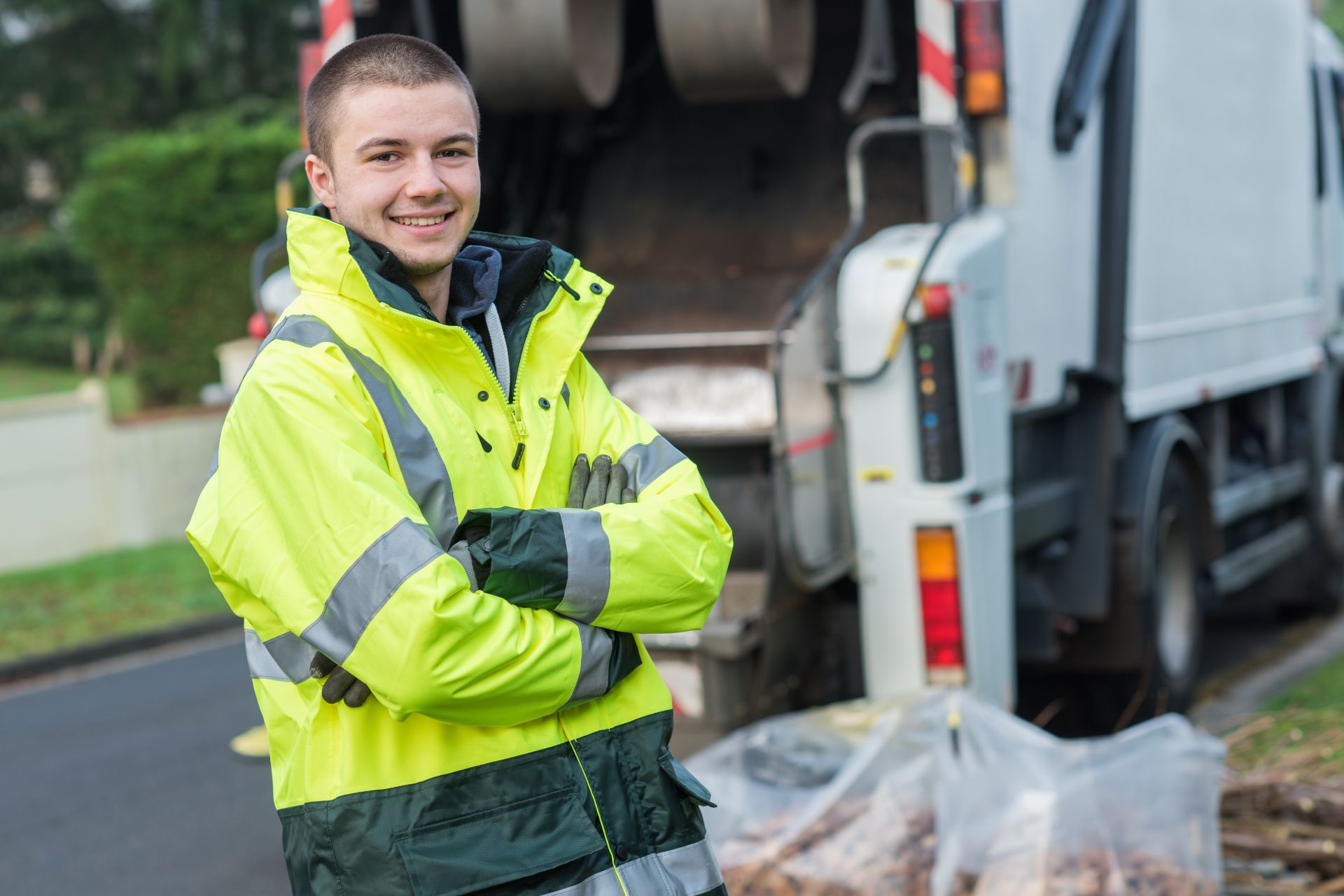 portrait of young smiling refuse collector