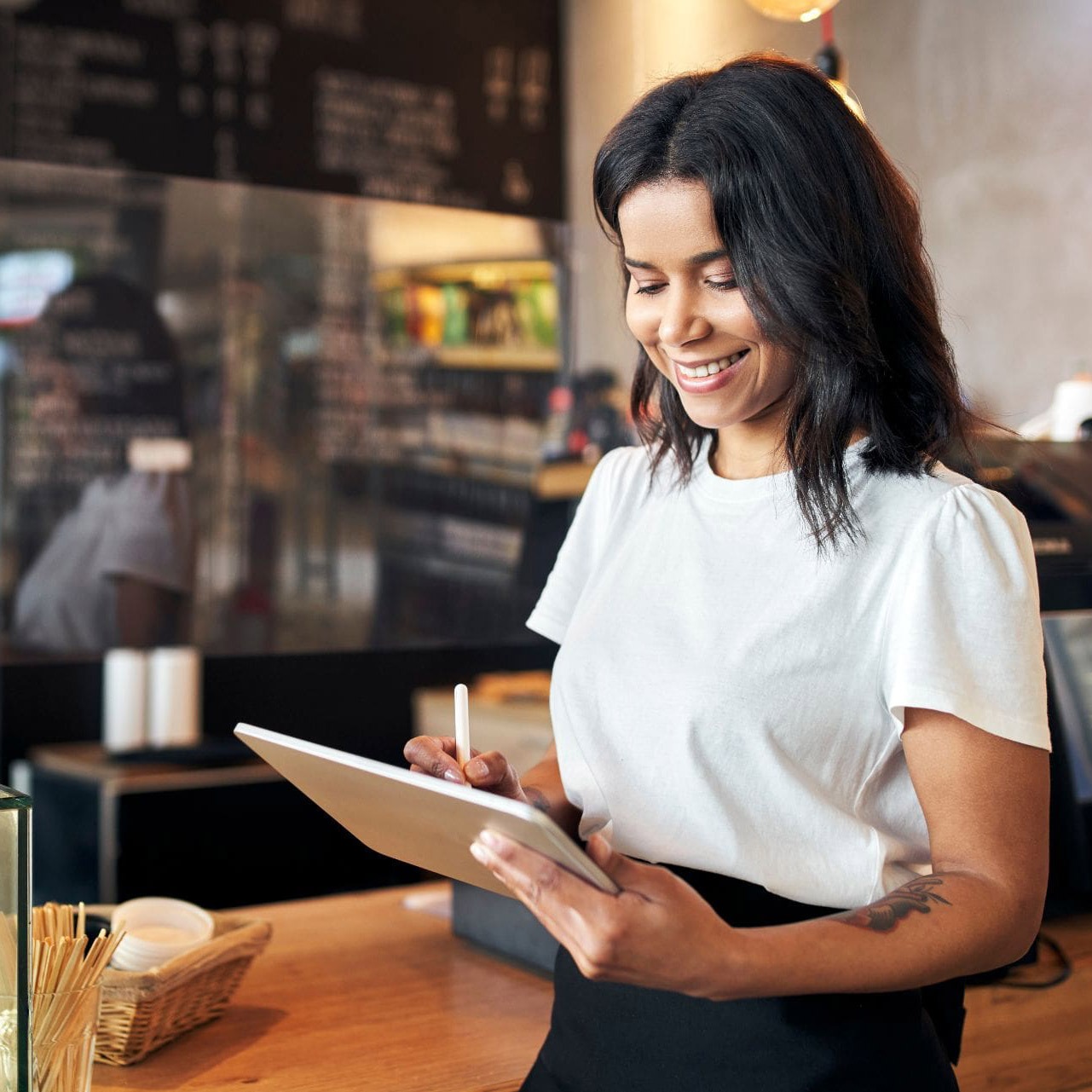woman using a tablet in a restaurant